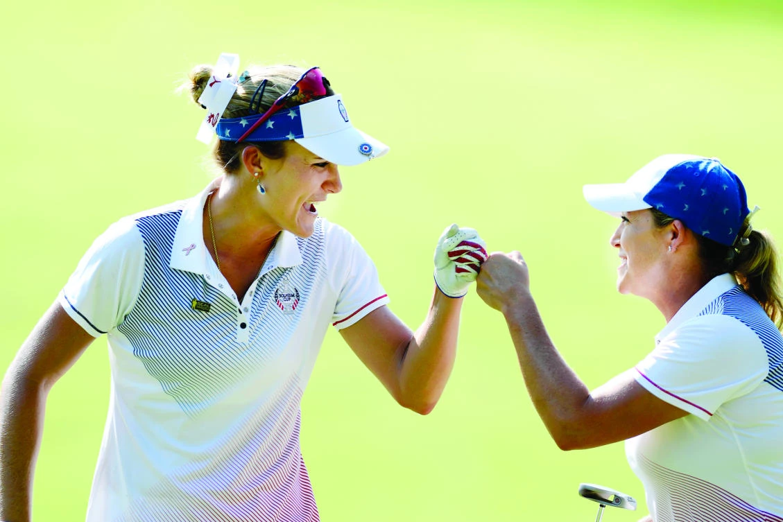 US golfers Lexi Thompson and Cristie Kerr celebrate on the 12th green during the second day
of the Solheim Cup international golf tournament at Des Moines Golf and Country Club Saturday. (USA TODAY Sports)