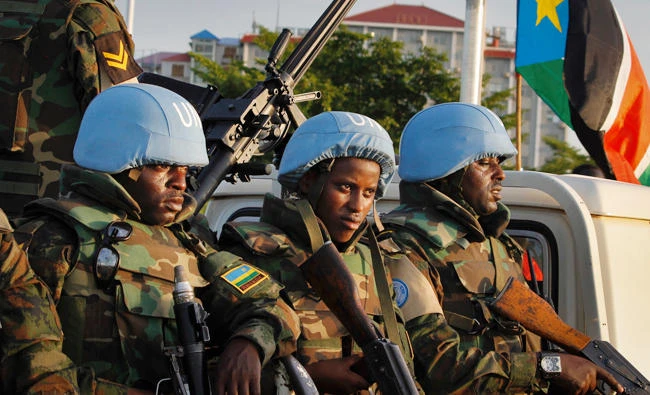 United Nations peacekeepers from Rwanda wait to escort members of the U.N. Security Council as they arrive at the airport in the capital Juba, South Sudan. (AP file)