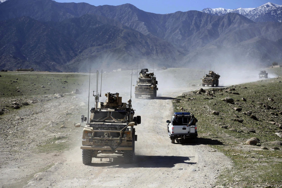 File: US forces and Afghan commando patrol Pandola village near the site of a US bombing in the Achin district of Jalalabad, east of Kabul, Afghanistan. (AP)