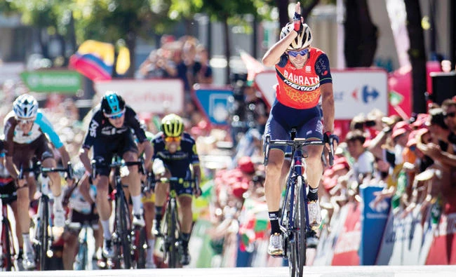 Bahrain-Merida’s Italian cyclist Vincenzo Nibali celebrates as he crosses the finish line to win the 3rd stage of the 72nd edition of "La Vuelta" Tour of Spain cycling race on Sunday. (AFP)