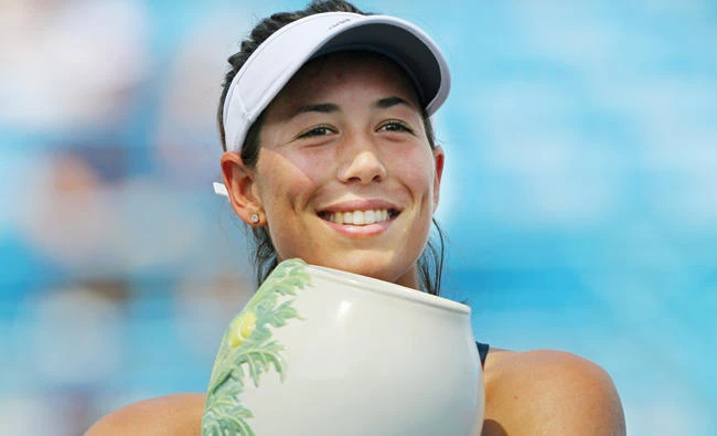Garbine Muguruza of Spain holds the Rookwood Cup after defeating Romania's Simona Halep in the finals of the Western and Southern Open at the Lindner Family Tennis Center Sunday. (USA TODAY Sports)