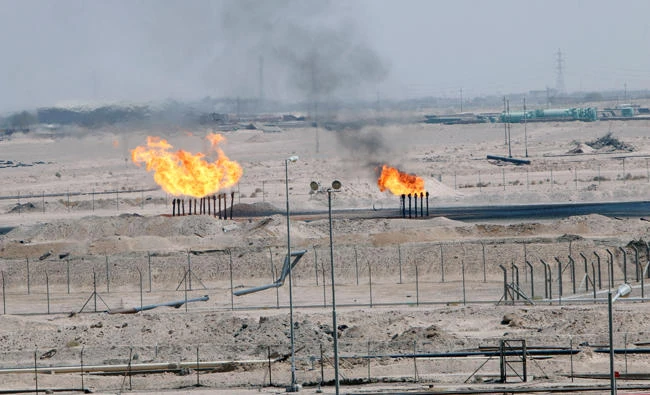 Excess gas is burnt off at a pipeline at the Zubair oilfield in Basra, Iraq, in this August 9, 2017 photo. (REUTERS)