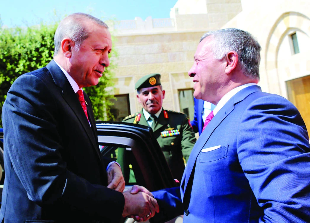 Jordan’s King Abdallah greets Turkish President Recep Tayyip Erdogan at the Royal Palace in Amman on Monday. (AFP)