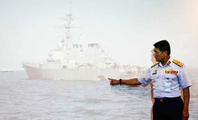 Malaysian Maritime Director Indera Abu Bakar points the damage of USS John S. McCain shown on a screen during a press conference in Putrajaya, Malaysia, on Monday. (AP)