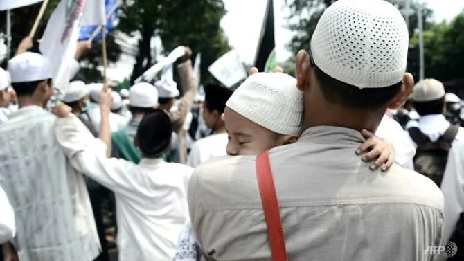 Siti Aisyah's conviction for blasphemy comes at a time of rising concerns about religious intolerance in Indonesia, where a Christian former Jakarta governor was also jailed for two years on blasphemy charges in May. (AFP)
