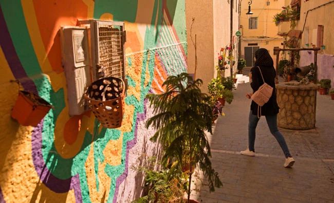 In this file photo, a Moroccan woman walking down a street in the old part of the port city of Tangiers. (AFP)