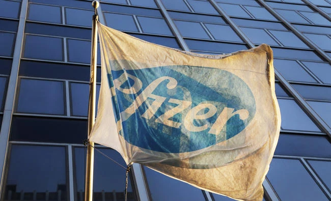 A Pfizer flag is displayed in front of the company's world headquarters in New York. (AP Photo/Mark Lennihan, File)