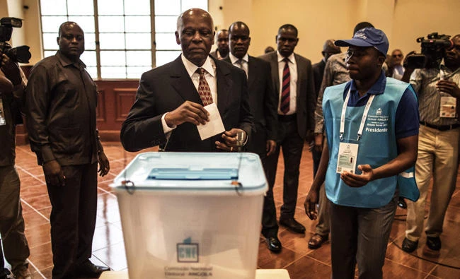 Angolan President Jose Eduardo dos Santos prepares to cast his vote in Luanda on Wednesday during the general elections. (AFP / Marco Longari)