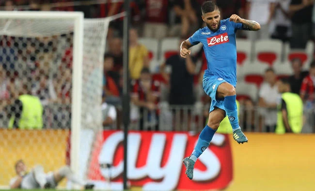 Napoli's Italian striker Lorenzo Insigne celebrates after scoring a goal during the UEFA Champions League playoff football match between Nice and Napoli at the Allianz Riviera stadium in Nice, southeastern France, on Tuesday. (AFP)
