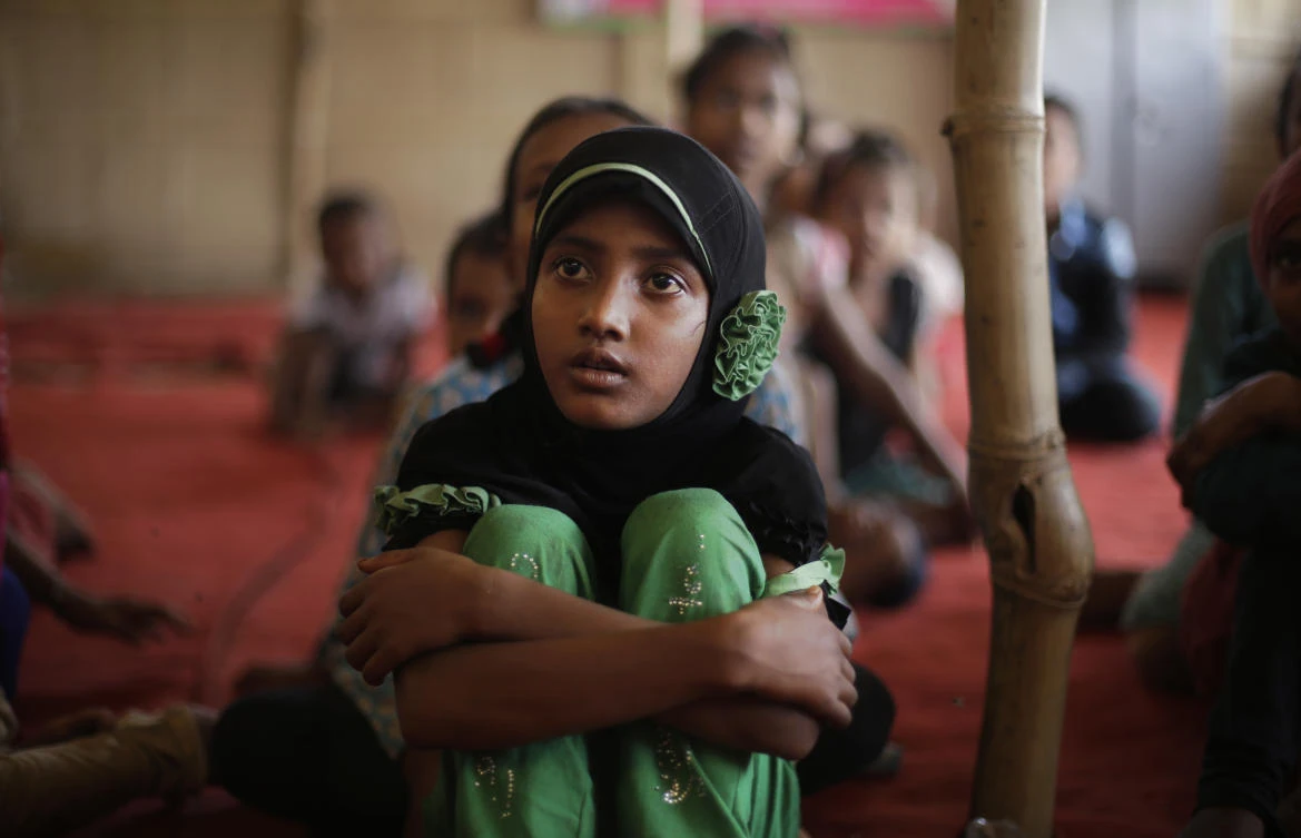 Children of Rohingya refugees attend a temporary school run by a non-governmental organization at a camp for Rohingyas in New Delhi, in this Aug. 16 photo. (AP)