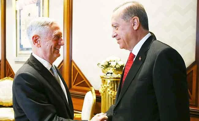 Turkey's President Recep Tayyip Erdogan, right, greets U.S. Defence Secretary James Mattis, prior to their meeting at the Presidential Palace in Ankara, Turkey, on Wednesday. (AP)