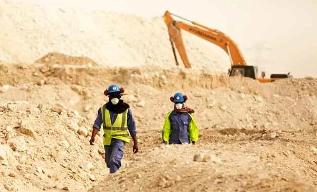 In this photo taken during a government organized media tour, workers walk back to the Al-Wakra Stadium worksite being built for the 2022 World Cup, in Doha, Qatar, in this May 4, 2015 file photo. (AP)