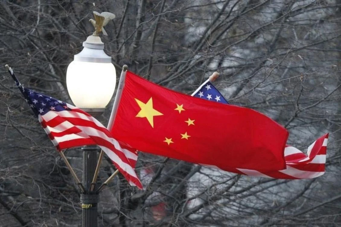 The People’s Republic of China flag and the US flag fly along Pennsylvania Avenue near the US Capitol in Washington. (Reuters)