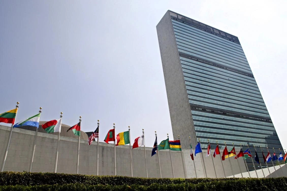 The flags of member nations fly outside the General Assembly building at the United Nations headquarters in New York, on September 13, 2005. (File Photo by AP)