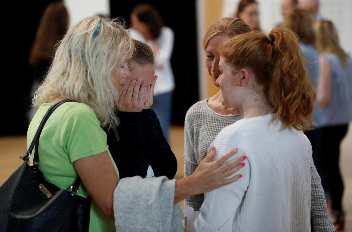 Students react after collecting their 'A' level exam results at Edgbaston High School for Girls in Birmingham, Britain August 17, 2017. (Reuters)