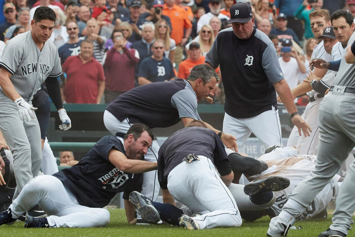 Detroit Tigers manager Brad Ausmus (center) and starting pitcher Justin Verlander (left) try to get players off Detroit Tigers first baseman Miguel Cabrera (bottom right) after benches clear during the sixth inning of the game against the New York Yankees at Comerica Park. (USA TODAY)