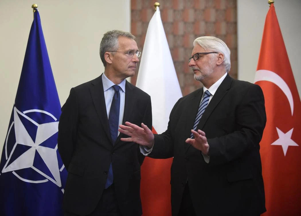 NATO Secretary General Jens Stoltenberg (L) and Foreign Affairs Minister of Poland Witold Waszczykowski (R) talk prior a meeting in Warsaw, Poland on August 25, 2017. (AFP)