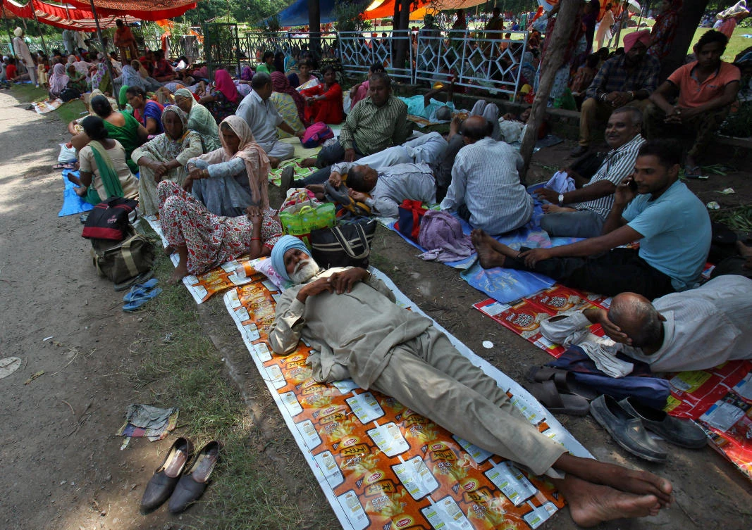 Supporters of Gurmeet Ram Rahim Singh rest as they gather near a stadium in Panchkula in the northern state of Haryana, India, August 24, 2017. (REUTERS)