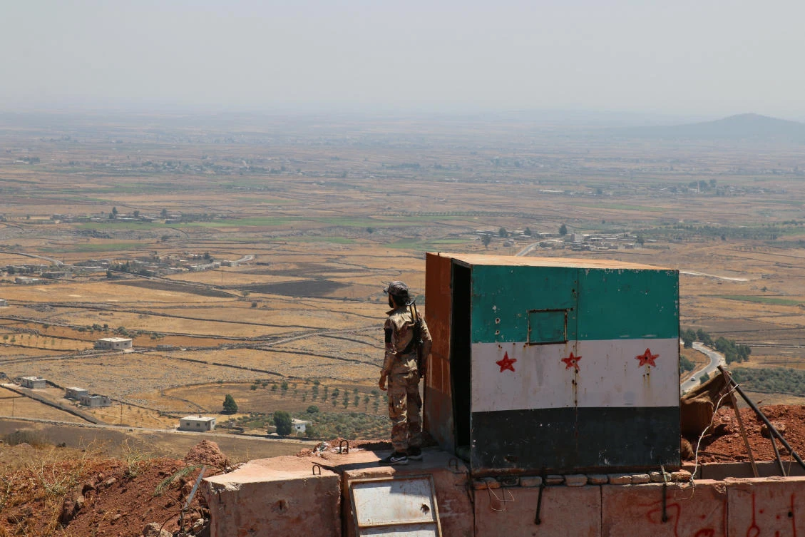 A Free Syrian army fighter stands as he holds his weapon in Quneitra countryside, Syria August 24, 2017. (REUTERS)