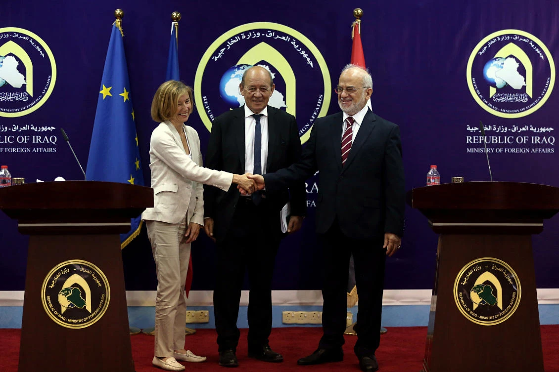 Iraqi Foreign Minister Ibrahim al-Jaafari, right, welcomes French Defence Minister Florence Parly, left, and French Foreign Affairs Minister Jean-Yves Le Drian, at a press conference in Baghdad, Iraq, Saturday, Aug. 26, 2017. (AP)