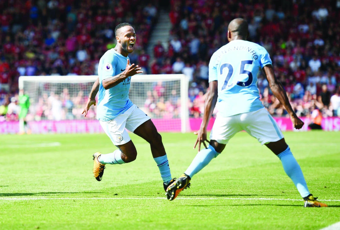 Manchester City's Raheem Sterling celebrates after scoring their second goal. REUTERS/Dylan Martinez
