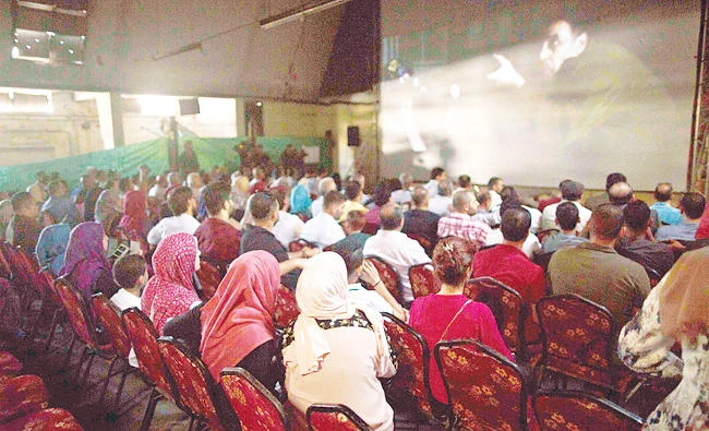 Palestinians attend the screening of ‘10 Years’ at Samer Cinema in Gaza City on Saturday. (AFP)