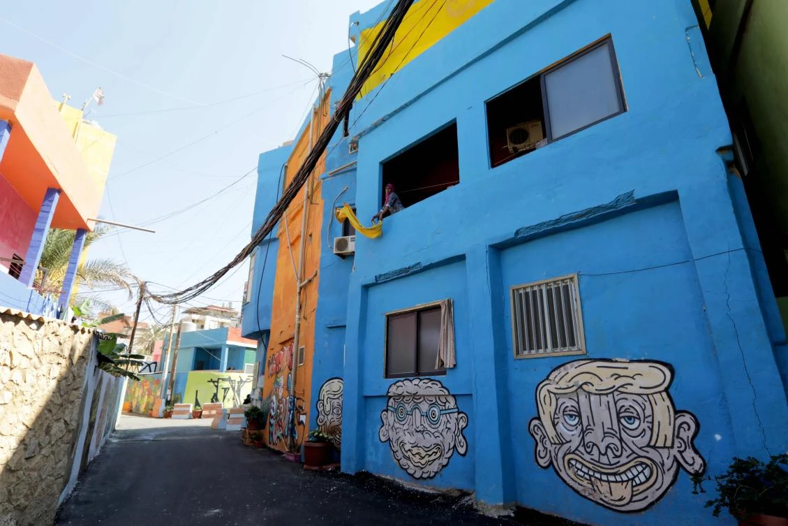 Painted houses in Beirut’s southern Ouzai neighborhood, on August 19, 2017. (File photo by AFP)