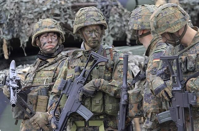 German soldiers and members of the NATO multinational battle group are pictured during a visit by German President and Lithuanian President in Rukla, Lithuania, on August 25, 2017. (AFP)