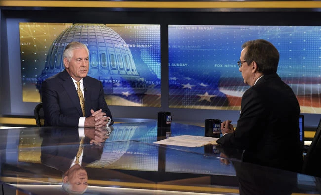Secretary of State Rex Tillerson, left, speaks during a television interview with Chris Wallace, right, the anchor of FOX News Sunday, in Washington on Sunday, Aug. 27, 2017. (AP Photo/Susan Walsh)