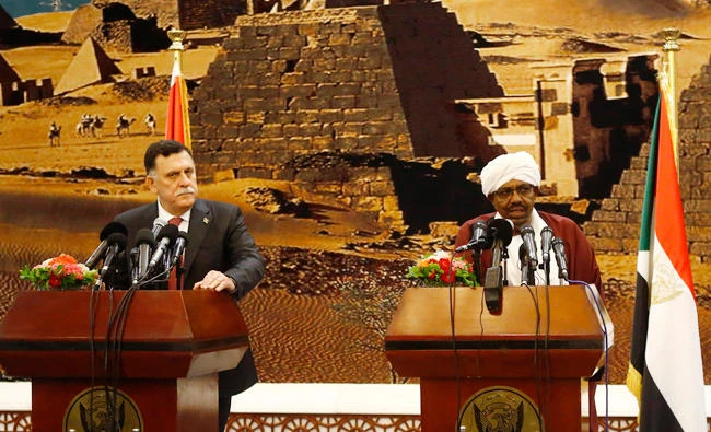 Sudanese President Omar al-Bashir, right and Libya's unity government chief Fayez al-Sarraj hold a press conference upon the latters's arrival in Khartoum on Sunday. (AFP)