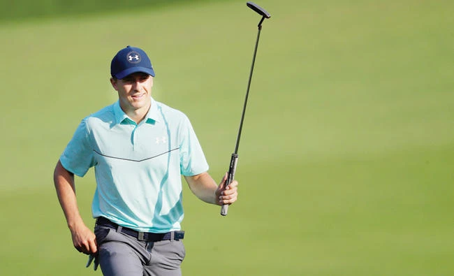 Jordan Spieth of the US acknowledges fans as he walks onto the 18th green during round three of The Northern Trust at Glen Oaks Club on Saturday in Westbury, New York. (AFP)
