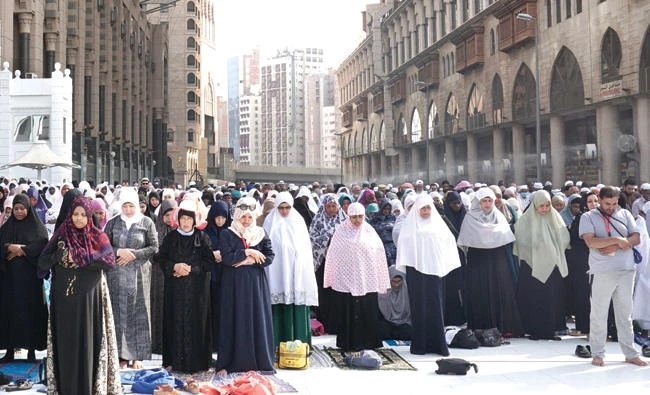 Muslim worshippers pray outside the Grand Mosque in Makkah on Sunday, prior to the start of the annual Hajj pilgrimage. (AFP)