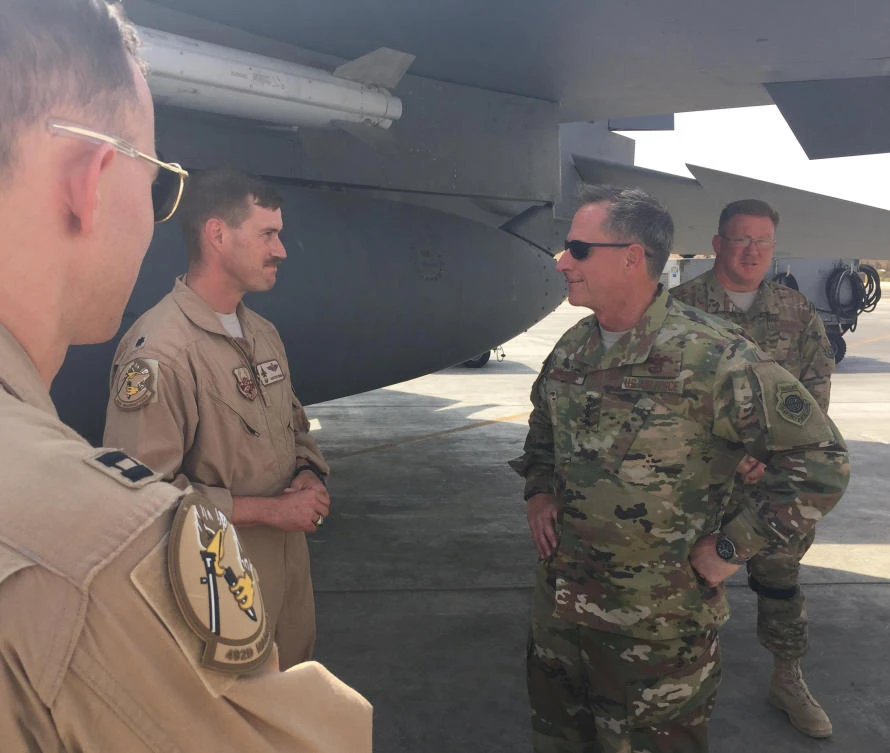 This handout photo shows Lt. Col. Jeremy Renken, center, speaks with US Air Force Chief of Staff General David Goldfein next to an F-15E Strike Eagle fighter jet at a US military installation in the Middle East. (US Air Force via Reuters)