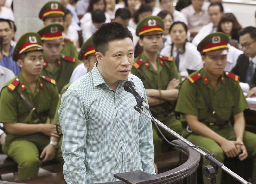 Ha Van Tham, former chairman of Ocean Bank, appears in a court in Hanoi, Vietnam, on August 28, 2017. (Vietnam News Agency via AP)