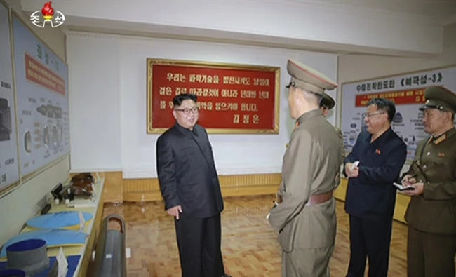 In this image made from video of a news bulletin aired by North Korea's KRT on Aug. 23, 2017, leader Kim Jong Un visits the Chemical Material Institute of Academy of Defense Science at an undisclosed location in North Korea.(KRT via AP Video)