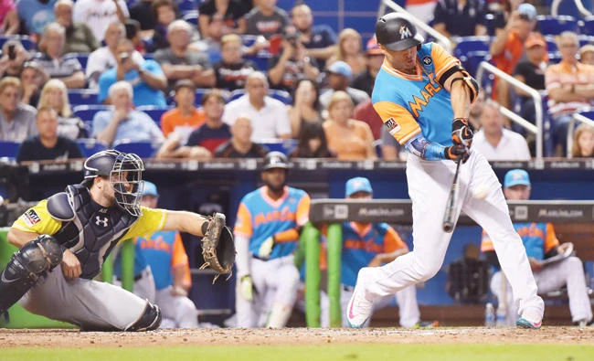 Giancarlo Stanton of the Miami Marlins hits his 50th home run of the season in the eighth inning against the San Diego Padres at Marlins Park on Sunday in Miami, Florida. (AFP)