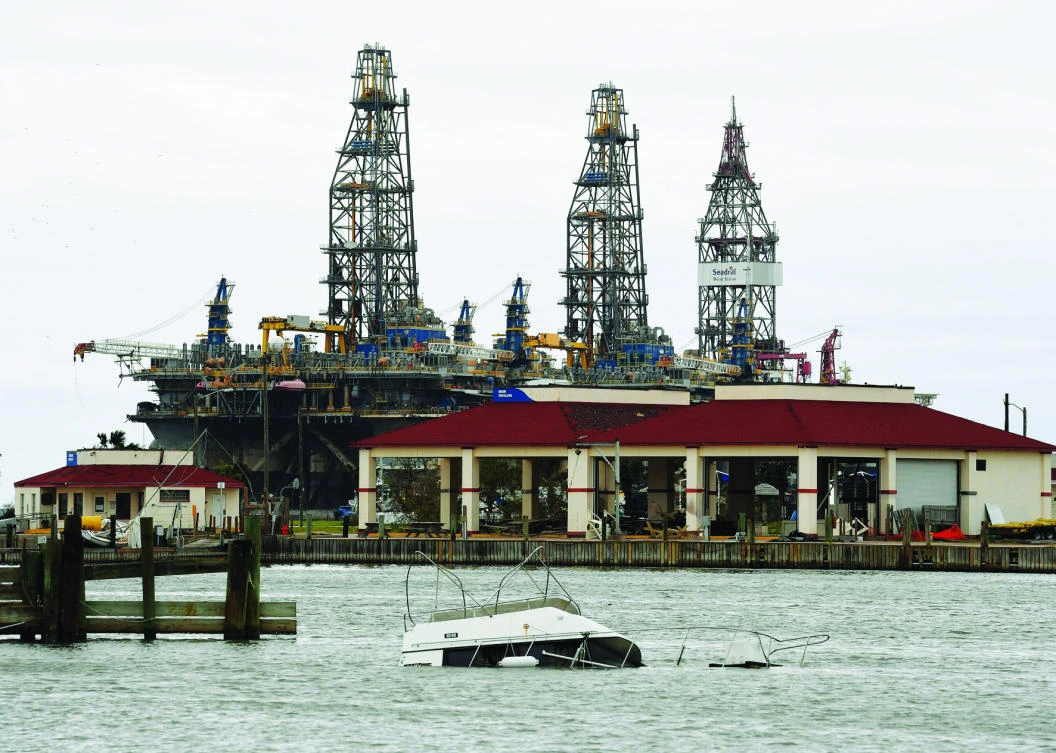 A sunken boat lies submerged in front of an oil rig after
tropical storm Harvey hit Port Aransas, Texas on Sunday. (AFP)