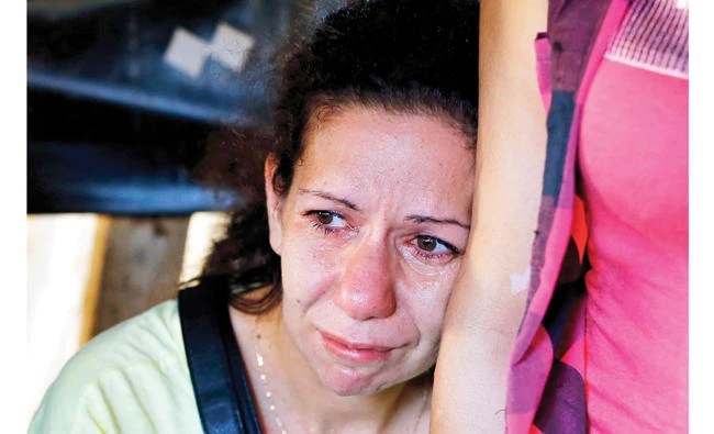 Amina kisses her son’s photo every day … now she must bury him