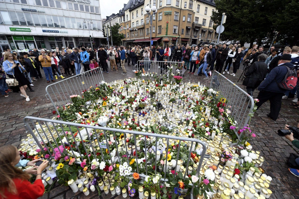Memorial candles and flowers at the Turku Market Square for the victims of Friday’s stabbings in Turku, Finland, on August 19, 2017. (File Photo: Lehtikuva via AP)