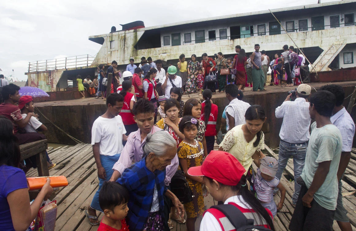 Fleeing Buddhist Rakhine residents arrive by ship from the unrest in Maungdaw at Sittwe jetty Tuesday, Aug. 29, 2017, in Sittwe, Rakhine State, western Myanmar. Recent violence in Myanmar's western Rakhine State has driven thousands of Muslim ethnic Rohingyas fleeing toward Bangladesh for safety, but less noticed is a smaller exodus of Buddhists from the Rakhine minority. (AP)