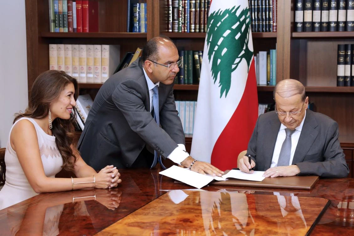 Lebanese President Michel Aoun, right, signs the country’s first animal welfare bill into law at the Baabda presidential palace, on August 29, 2017. (AFP)
