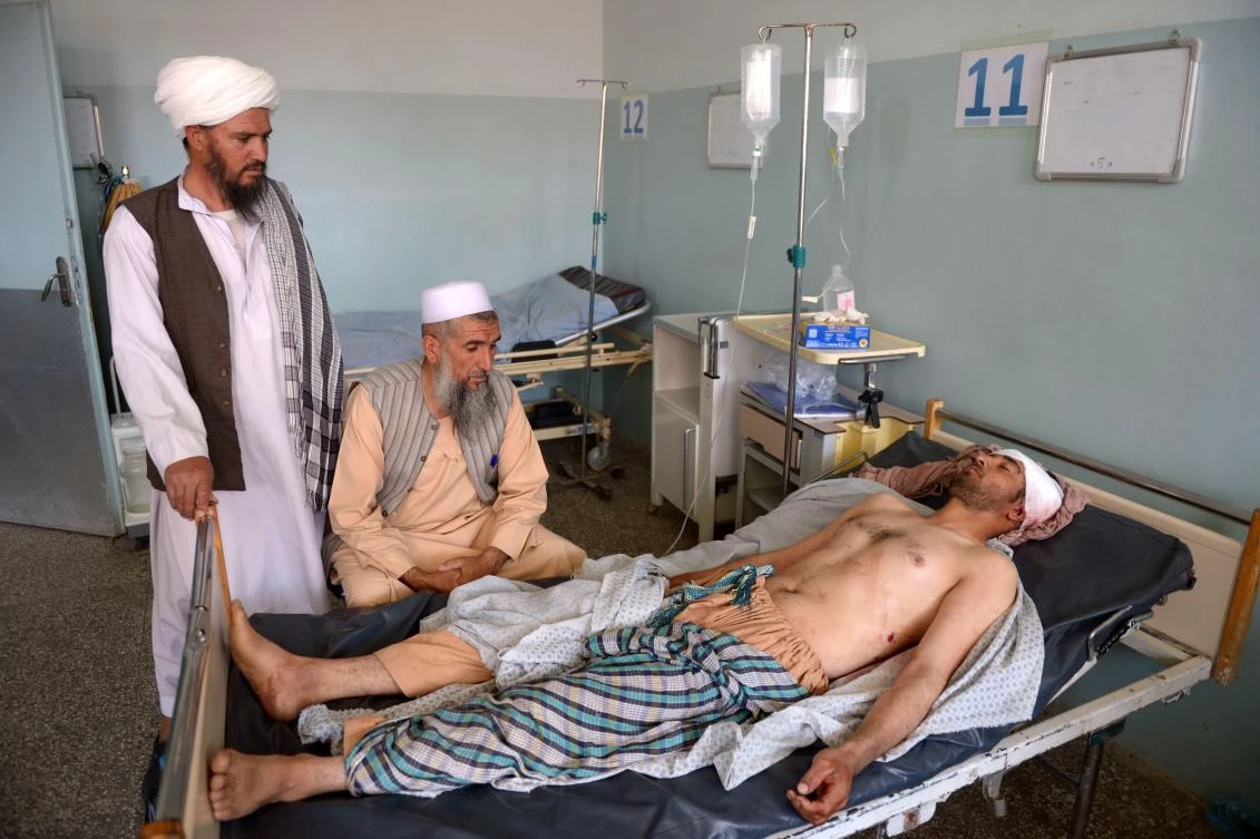 An injured Afghan man receives treatment at a hospital following an airstrike in Herat on August 29, 2017. (AFP)