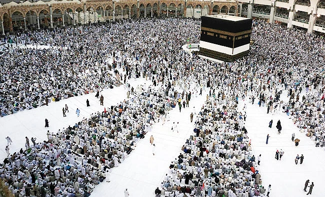 Muslim pilgrims sit and circumambulate around the Kaaba, the cubic building at the Grand Mosque, ahead of the annual Hajj pilgrimage in the Muslim holy city of Makkah, Saudi Arabia on Monday. (AFP)