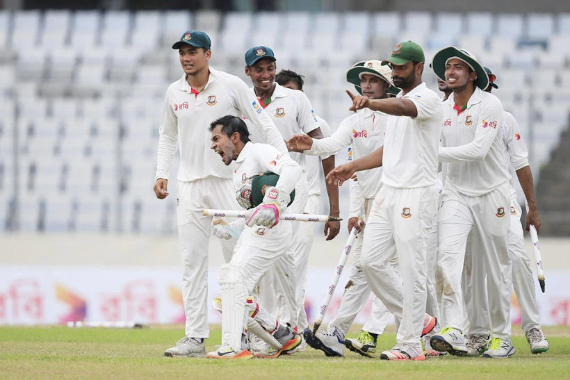 Bangladesh’s cricket team captain Mushfiqur Rahim, second left, and his teammates celebrate their victory against Australia during the fourth day of their first test cricket match in Dhaka, Bangladesh, on Wednesday, August 30, 2017. (AP)