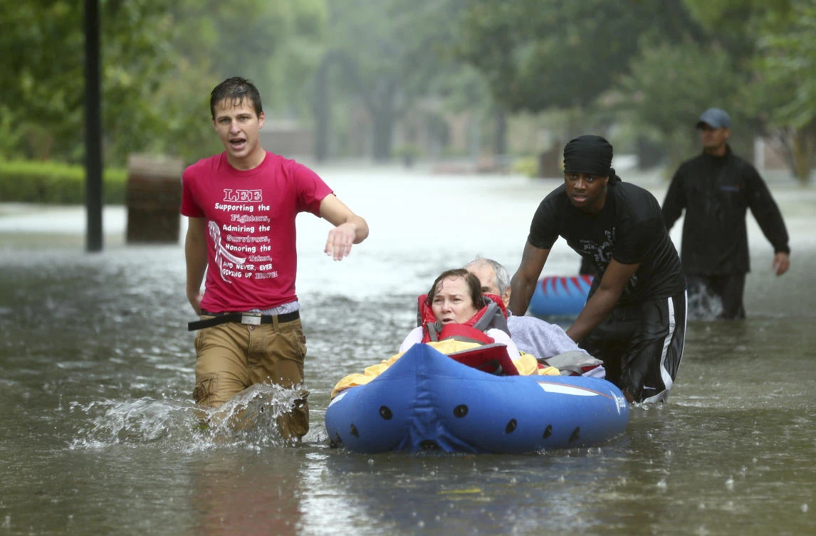 Residents are evacuated from their homes as floodwaters from Tropical Storm Harvey rise, Monday, Aug. 28, 2017, in Houston. (AP)