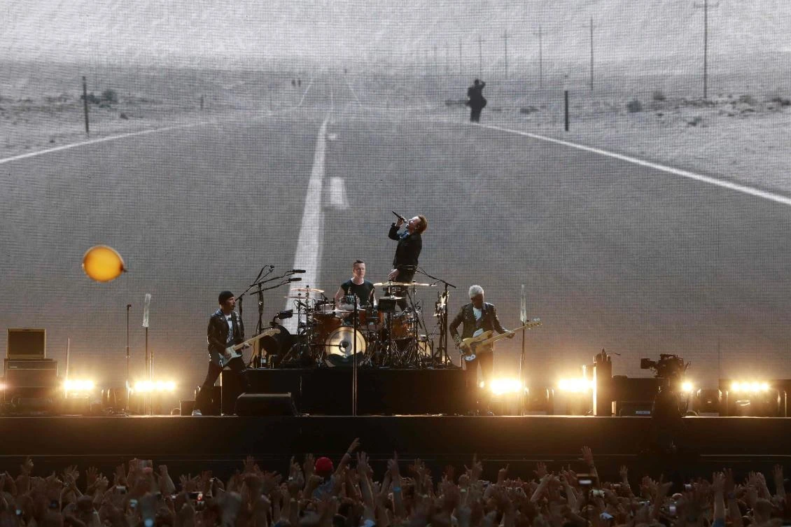 This file photo shows the Irish rock band U2 performing on stage at the Stade de France in Saint-Denis, outside Paris, on July 25, 2017. (File photo by AFP)