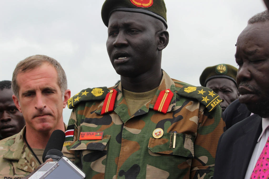 Brig. Gen. Lul Ruai Koang of the Sudan People's Liberation Army (SPLA) addresses the media on the killing of US journalist Christopher Allen at the morgue of the military hospital in Juba, South Sudan, Tuesday. (Reuters)