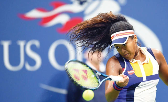 Japan’s Naomi Osaka returns the ball to Germany’s Angelique Kerber during their 2017 US Open match at the USTA Billie Jean King National Tennis Center in New York on Tuesday. (AFP)