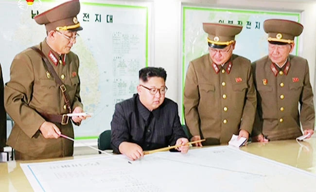 In this file photo made from video of an Aug. 14, 2017, broadcast in a news bulletin by North Korea's KRT, North Korean leader Kim Jong Un receives a military briefing in Pyongyang. (AP)