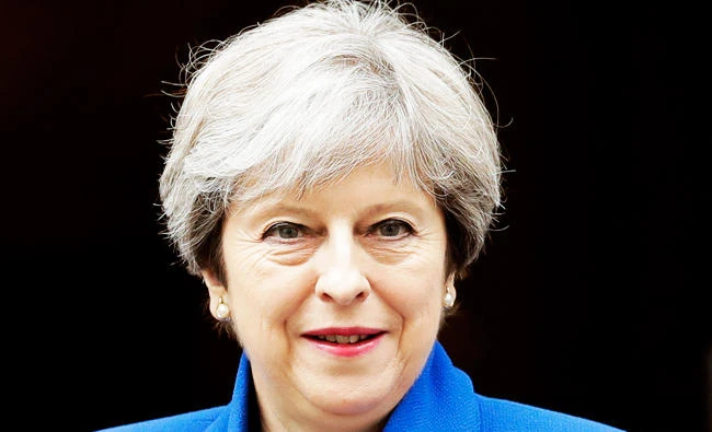 In this July 19, 2017 photo, British Prime Minister Theresa May leaves 10 Downing Street in London, to attend Prime Minister's Questions at the Houses of Parliament. (AP)